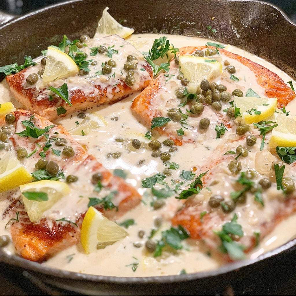 Creamy Salmon Piccata served with Prosciutto Wrapped Asparagus